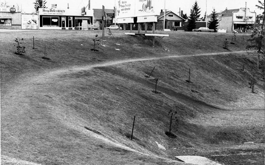 MacKinnon Ravine along Stony Plain Road, east of 149th St. Louie's Grocery, Harry Walker Real Estate and Jamieson Hardware in the background. Courtesy of City of Edmonton Archives, EA-20-4767.