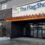 Exterior of The Flag shop featuring the sign of the business.