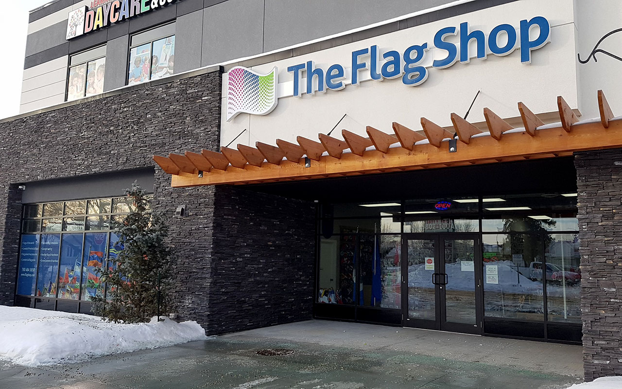 Exterior of The Flag shop featuring the sign of the business.