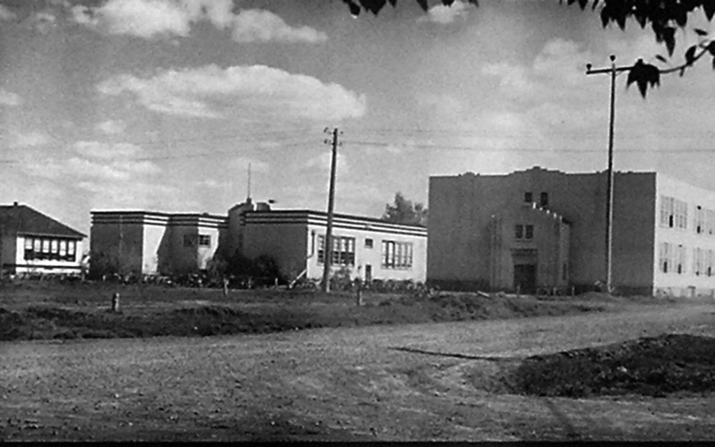 B&W photo of 3 school buildings from ca. 1960.