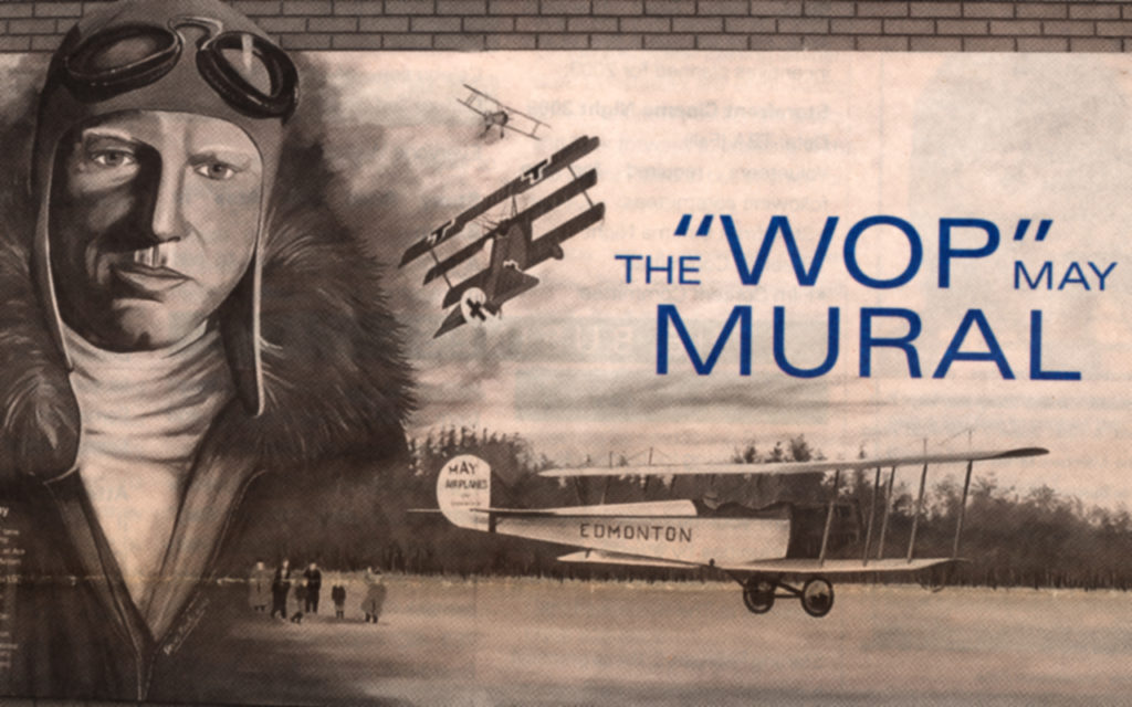 Mural depicting sketches of "Wop" May, planes he flew in WWI, and a plane with Edmonton on the side landing in what is now Mayfield