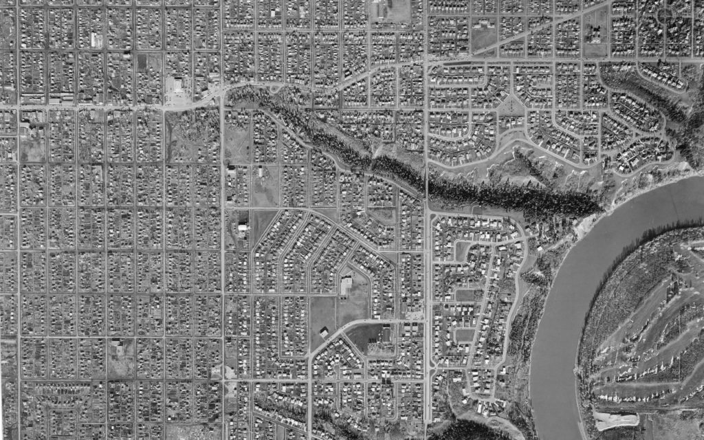 Detail of an aerial photograph showing how, in 1957, MacKinnon Ravine crosses 149th Street. The Ravine hasn't been filled in and Loblaw's not built yet. Courtesy of City of Edmonton Archives, 1957Aerial_Ln8_No255581957.