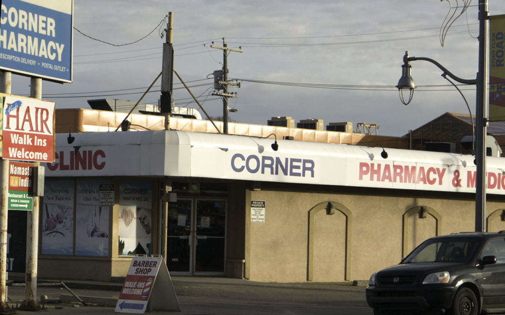 Corner Pharmacy before it was demolished to make way for the Valley-Line LRT. Photographer: Don Bouzek,