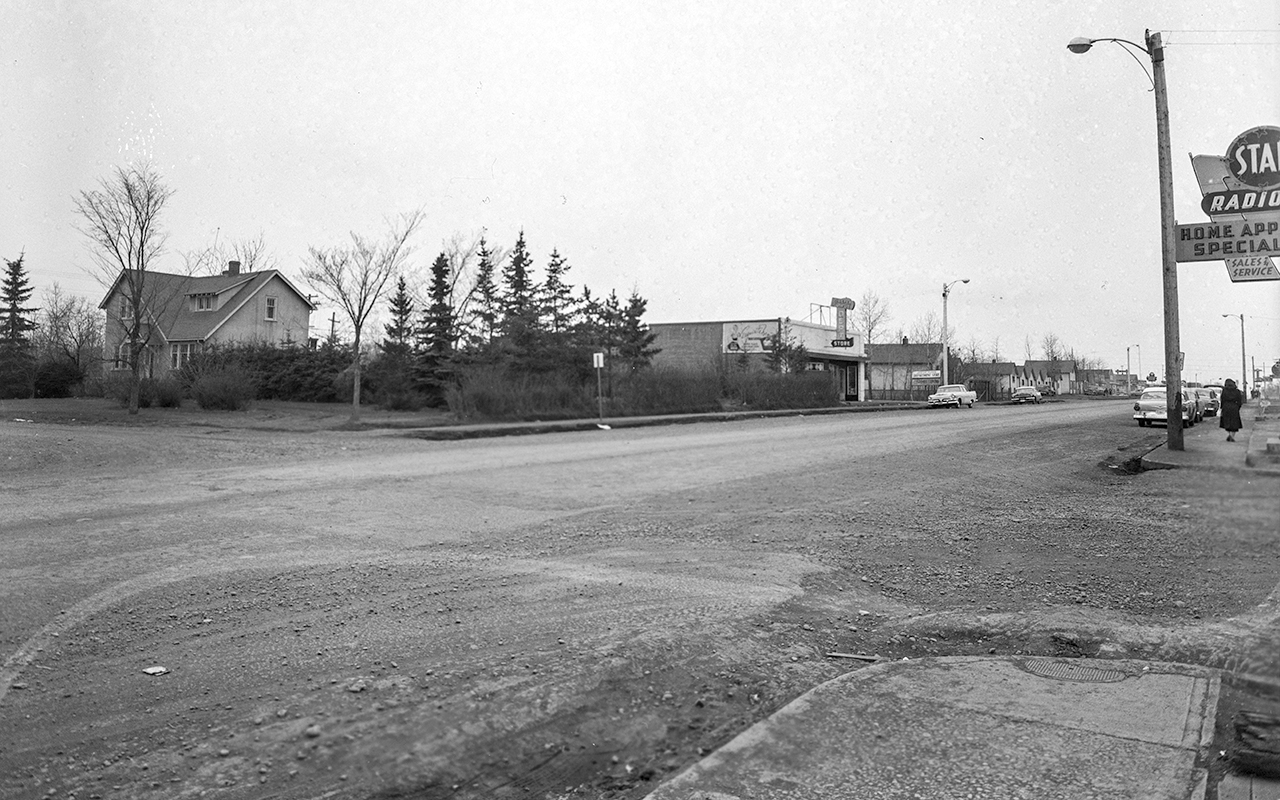B&W photo of Stony Plain Road at 153rd St. Jasper Place Department Store and Star Radio visible.