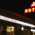 Colour photo of exterior with neon sign at New West Hotel, January 1, 1980. Courtesy of Paul Balanchuk via Flickr.