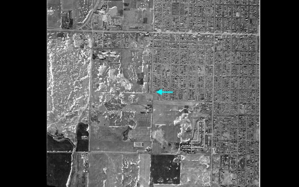 B&W aerial photo from 1957, shows south of Stony Plain Road. Arrow points to 163rd Street and 96th Avenue.